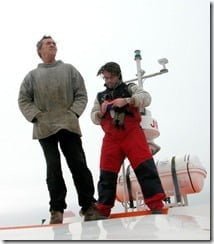 Whale watching operator Colin Barnes (left), and Pádraig Whooley of the IWDG scan for whale activity from the roof of the boat.