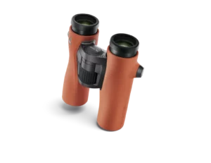 A pair of binoculars on a black background with Swarovski Optik NL Pure 10x32 Binocular Review.