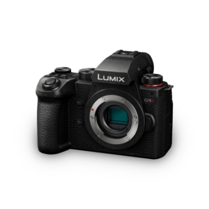 A Panasonic Lumix G9II mirrorless camera with a visible sensor and dials, isolated on a white background.